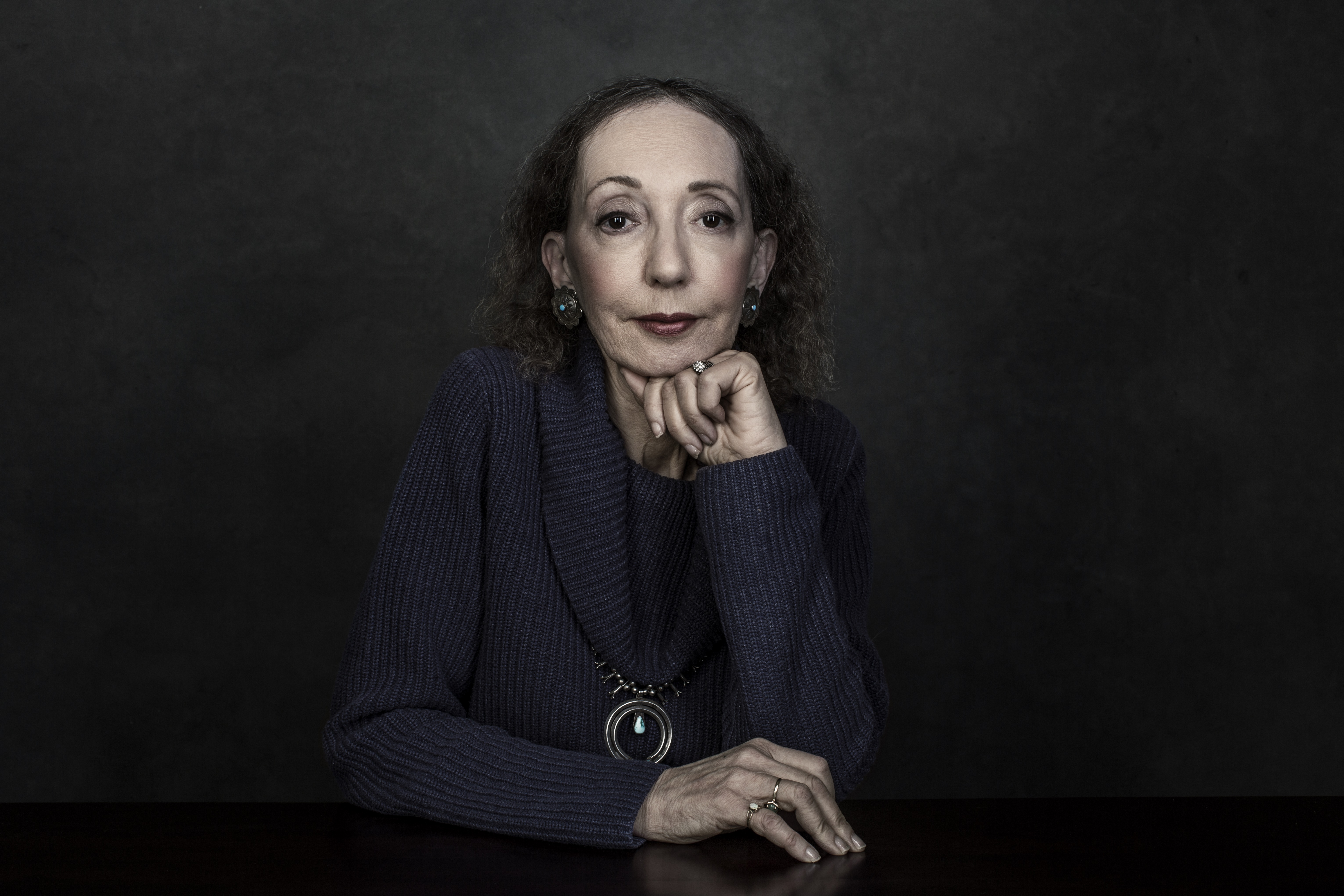 An author photo of Joyce Carol Oates, who is looking at the camera.; A Reading by Joyce Carol Oates