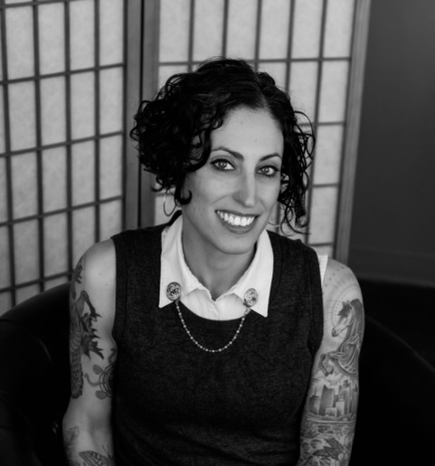 A photograph of a woman with short dark hair smiling for the camera.; Academic Freedom in the Time of Genocide