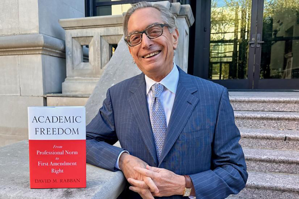 Author photo of David M. Rabban standing next to his book.; Academic Freedom: From Professional Norm to First Amendment Right&nbsp;