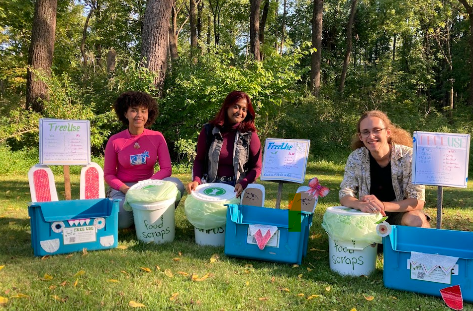 Students prep food scrap and reuse collection bins to go into the residence halls.