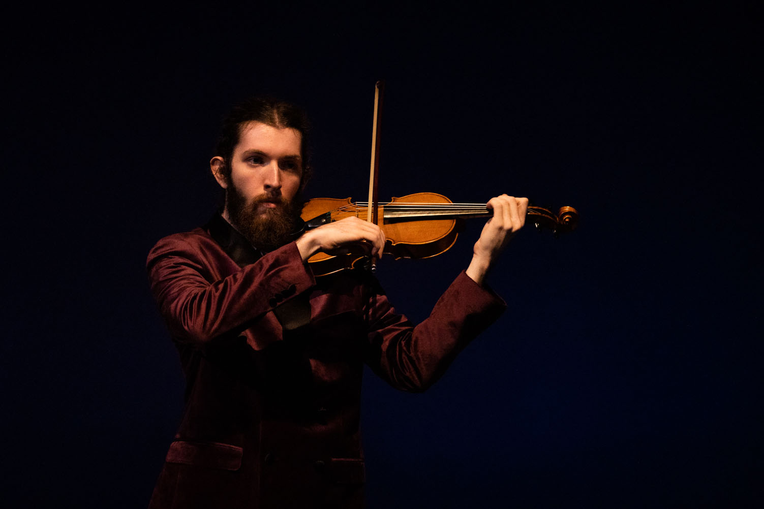 Student playing violin.