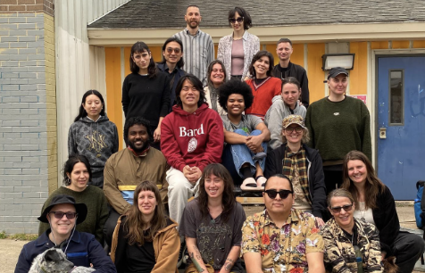 A group of MFA students smile for the camera.